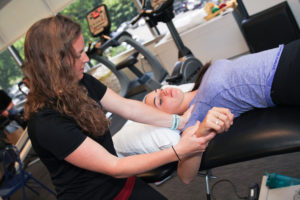 Physical therapist looks at a possible torn rotator cuff