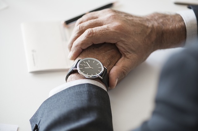 person checking wristwatch