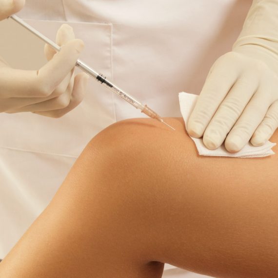 Woman receiving Botox treatment for knee pain