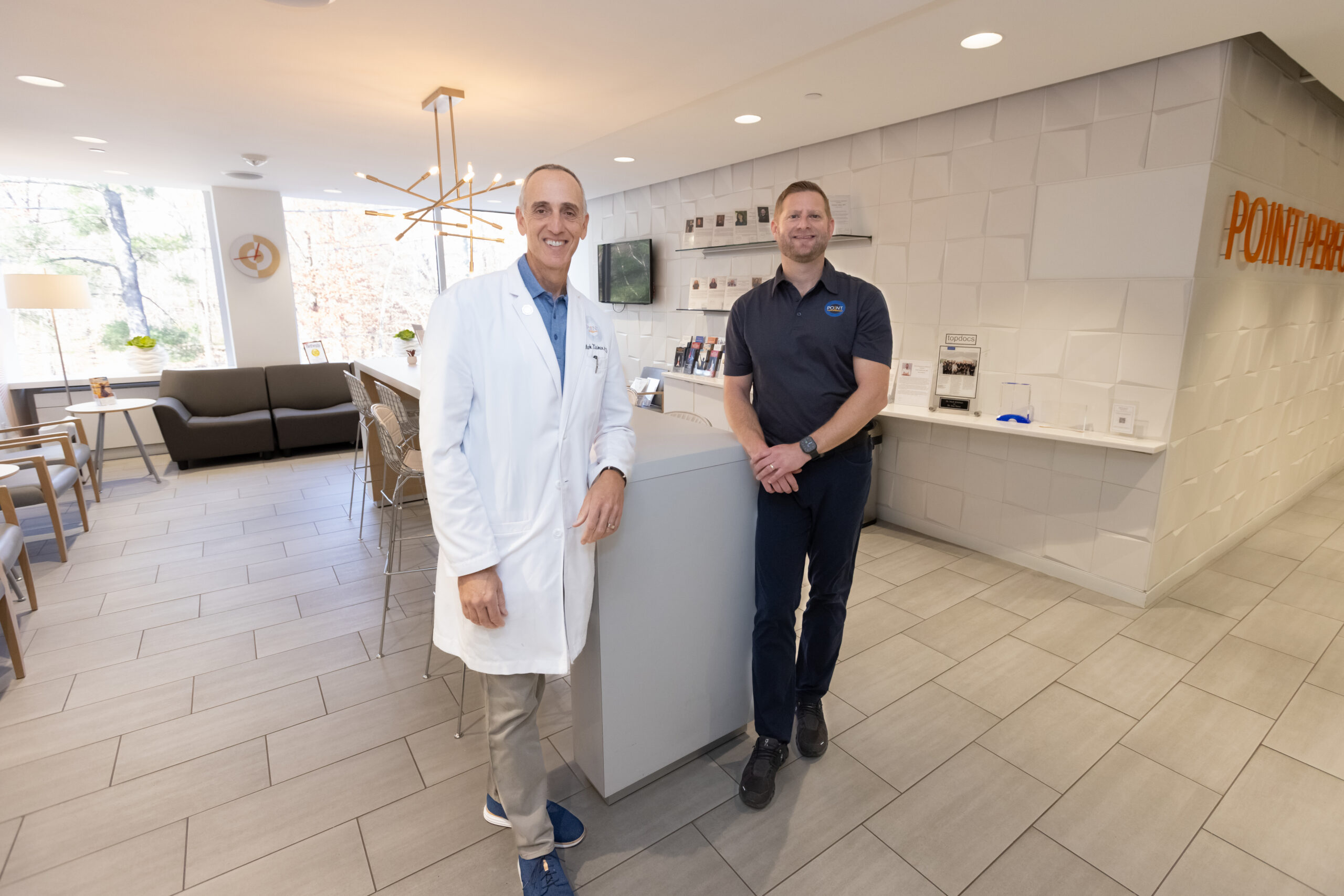 Dr. Mark Klaiman and Dr. Haim Hechtman standing on either side of a countertop in Point Performance